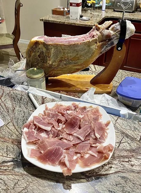 Prosciutto fresh off the pig. This lovely piece of meat you see has never been cooked, but created by using salt for 2 years.  The salt used in the preparation draws out blood and moisture, preventing bacteria from entering the meat.. I came , I butchered, [i ate]