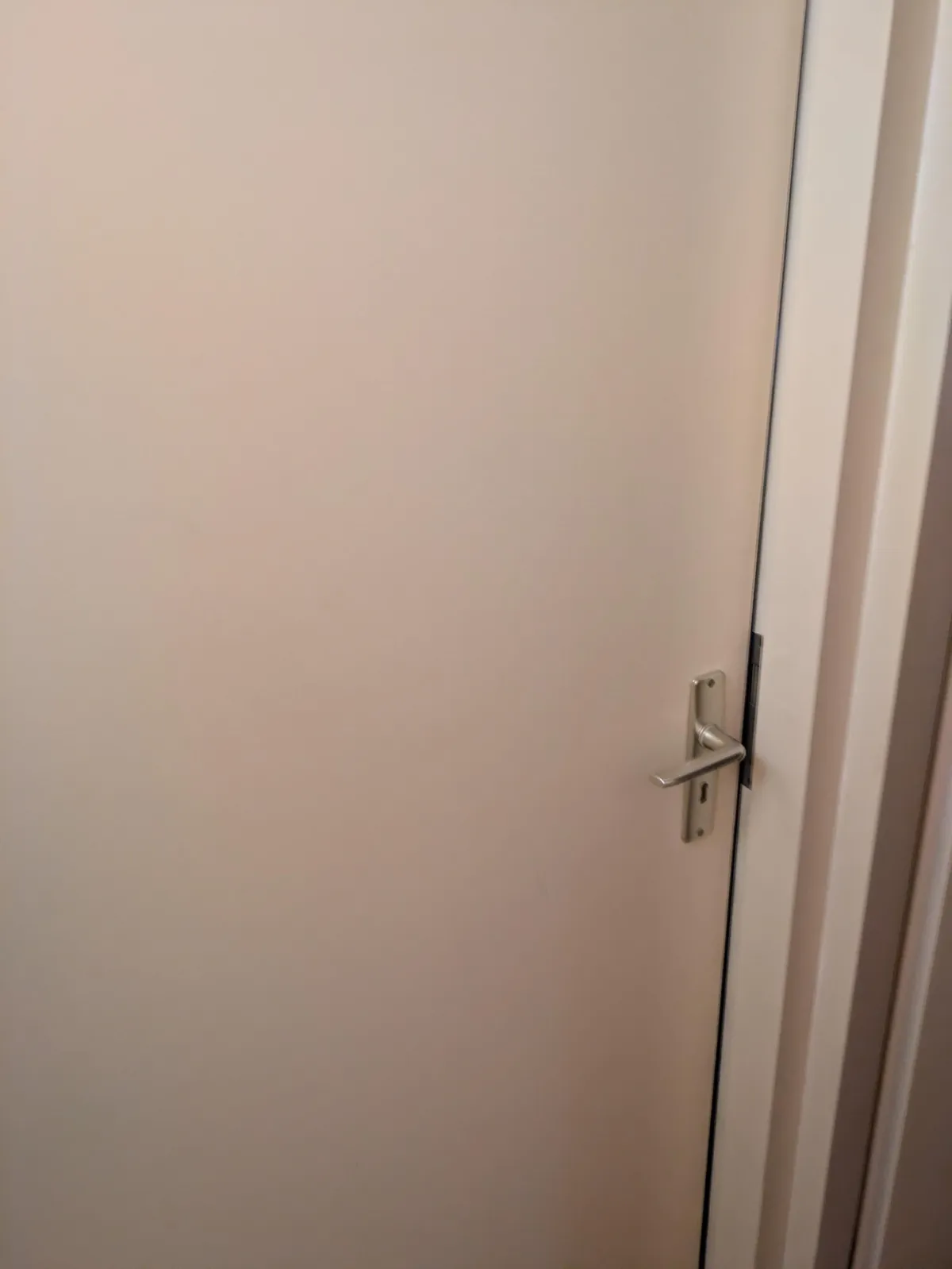 Bedroom door blocked from the inside with a fallen coffee table - what can i try?