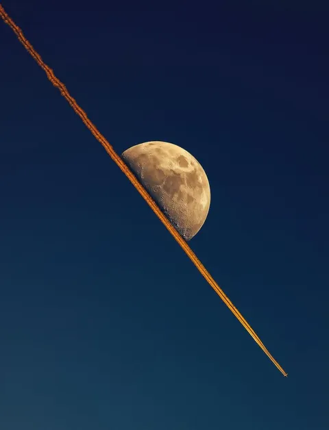 When a jet's contrail lined up perfectly with the moon.