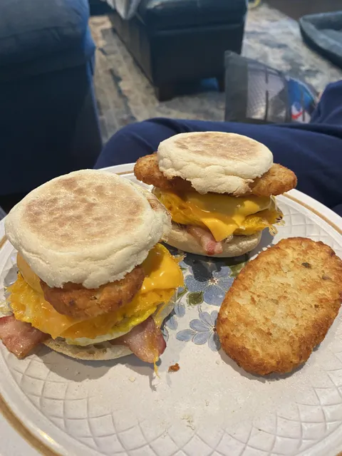 [homemade]: two egg McMuffins with sausage and bacon with hash browns