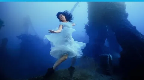 Canadian photographer Steven Haining breaks world record for deepest underwater photoshoot at 163ft - model poses on shipwreck WITHOUT diving gear