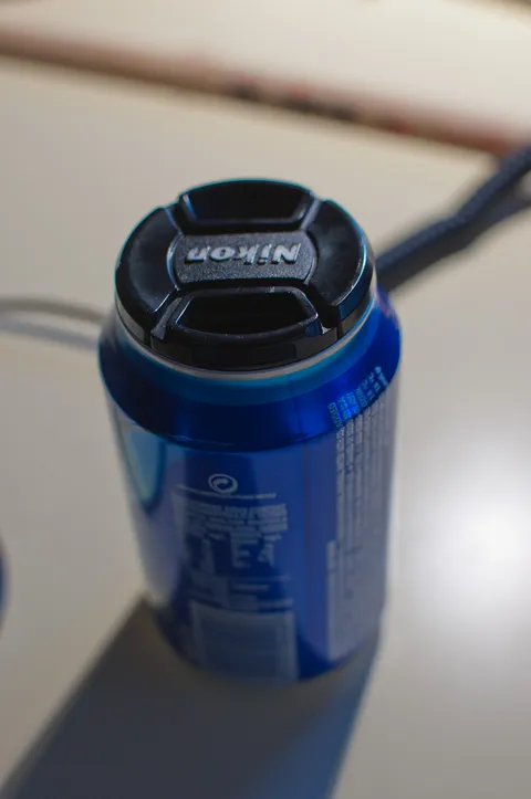 TIL that you can neatly snap a Nikon 52 lens cap on top of any beverage can