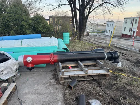 A fire hydrant before it goes into the ground.