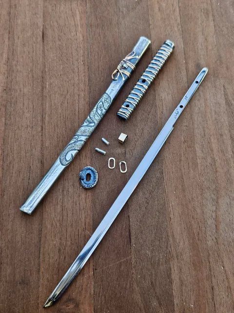 I handmade a gold and silver katana