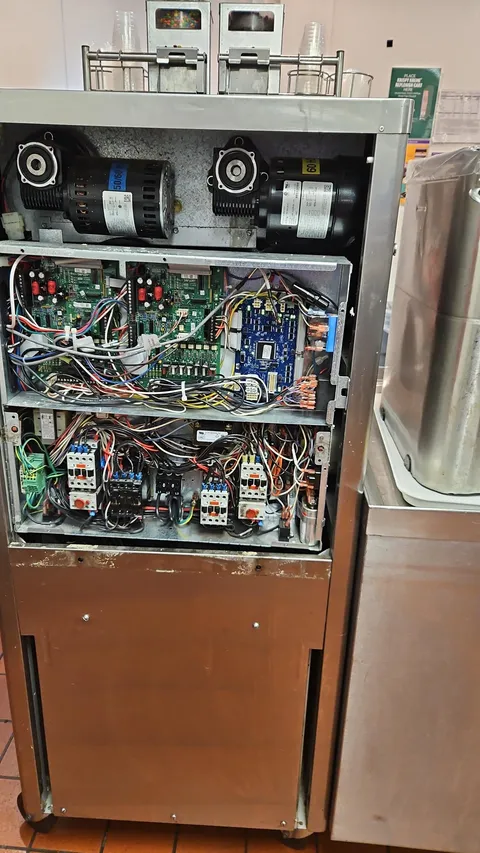 The inside of a mcdonalds ice cream/shake machine