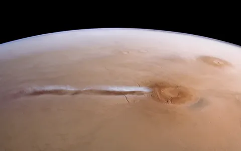This elongated cloud has formed as a result of wind encountering the Arsia Mons mountains on Mars. It forms almost every day during a specific season, from early morning until noon. (Image credit: ESA/DLR/FU Berlin/A. Cowart)