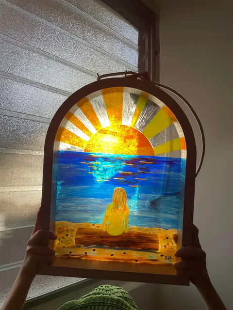 My uncle made us some stained glass art based on a photo of our daughter.