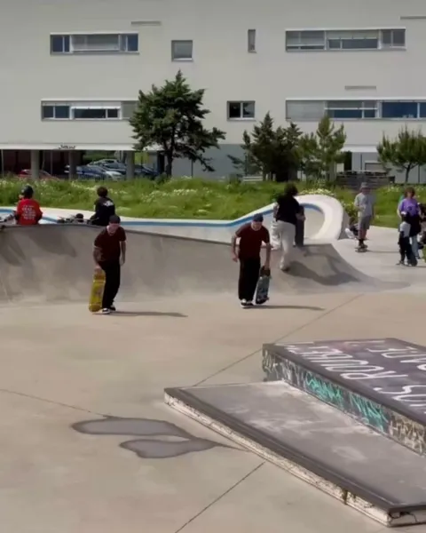 Twin brothers skateboarding in perfect sync