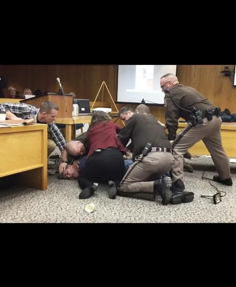 After hearing how Larry Nassar abused hundreds of young athletes, a father of three victims tried to attack him in court, shouting that he wanted “five minutes alone".