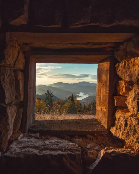 Tara National Park through the window of an abandoned hut, Serbia