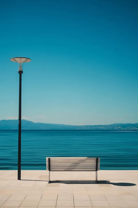 ITAP of a bench and a lamp post in Krk, Croatia