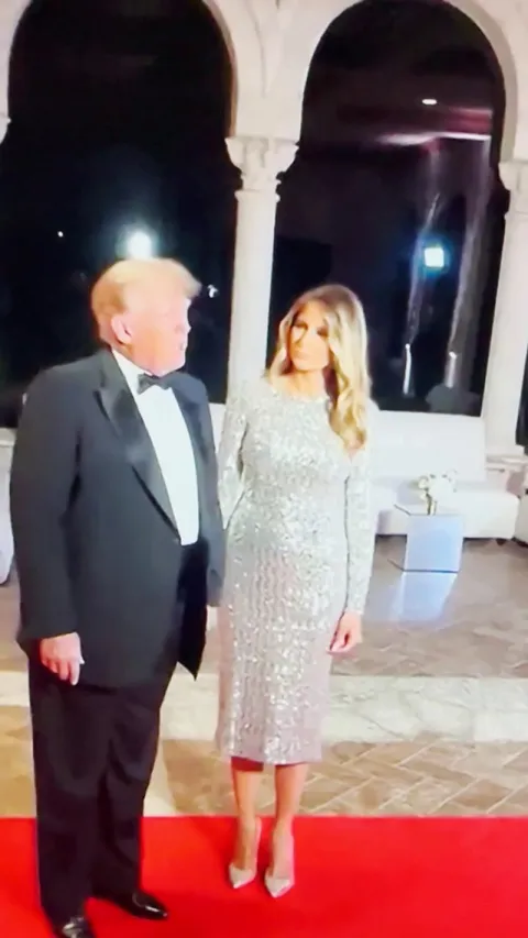 Melania Trump using every ounce of will power she can muster to smile for half a second while holding Donald Trump’s tiny hand.