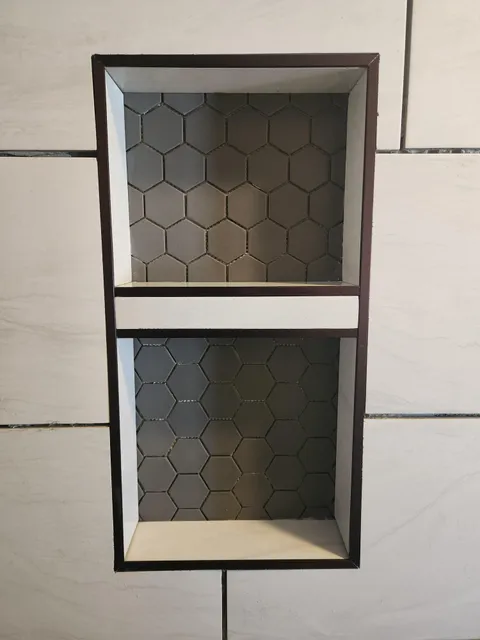 I spent all day tiling my shower and didn't notice my mistake till I took the photo. Wife says to leave it alone. Is it noticeable?