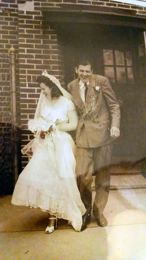 My parents encountering a rice barrage after leaving Our Lady of Mount Carmel church on their wedding day in 1949. Married 60 years until Dad passed and Mom will be 100 in a few months.
