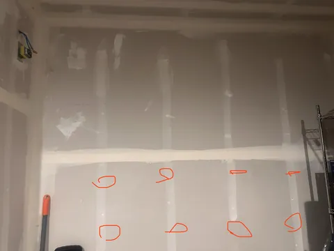 Can I drill a hole in my garage w/o stud finder?