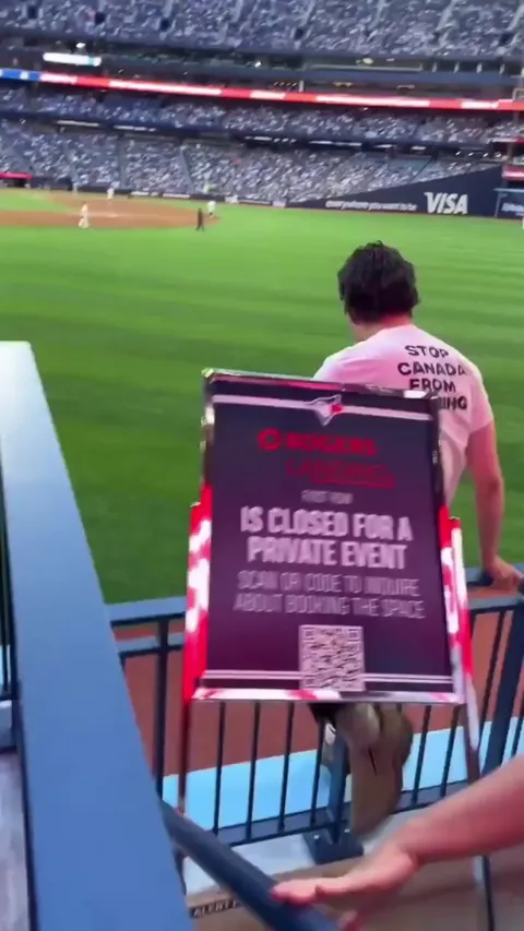 Just Stop Oil protestors run on the field during Toronto Blue Jays game. 