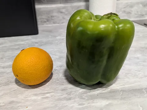 The size of this green pepper I bought at the grocery store (orange for scale)