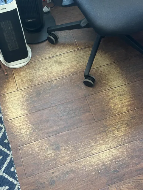 I screwed up. I didn't put one of those plastic protectors under my office chair and now I have the ring of death. Not entirely sure what the surface is, but it's definitely not real wood. Any suggestions on how to restore the flooring in my apartment complex before I move out?