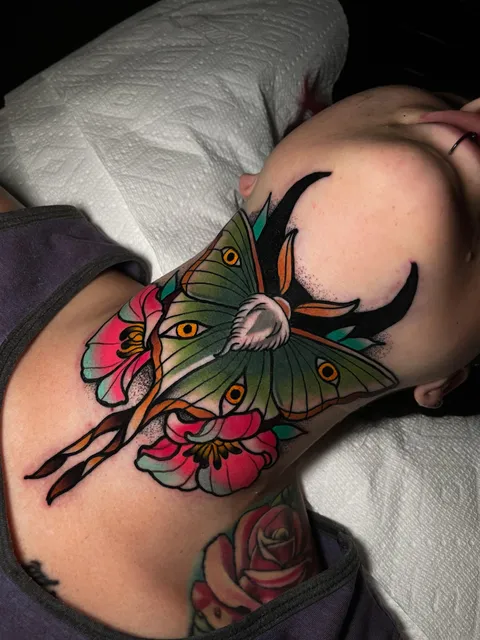 Luna moth throat tattoo by Cory Cartwright in Woodstock, Ga