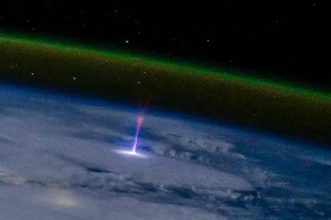 Blue jet-sprite photographed from ISS, details in comments.