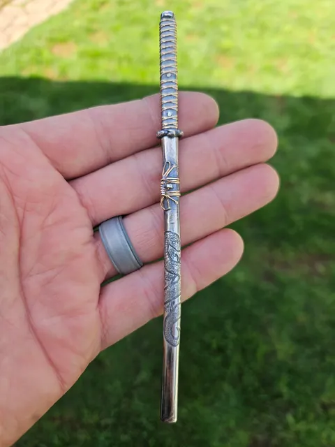 I handmade a gold and silver katana