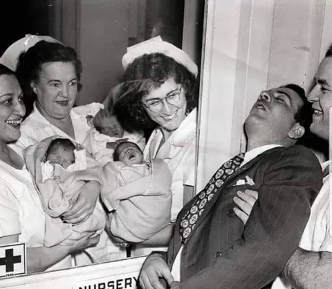 A new father faint in 1946, after learning his wife had triplets.