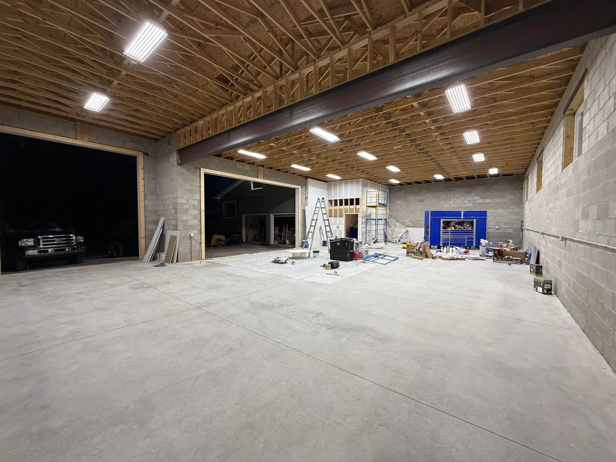 Occupancy permit achieved. Now it’s time for doors, lift, waste oil heater, driveway, and sealing the floors