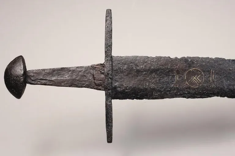 This Medieval Sword Pulled From a Dutch Riverbed Is Marked With Intricate Copper Symbols | The artifact was remarkably preserved for a millennium in anaerobic clay on a private estate near the city of Montfoort