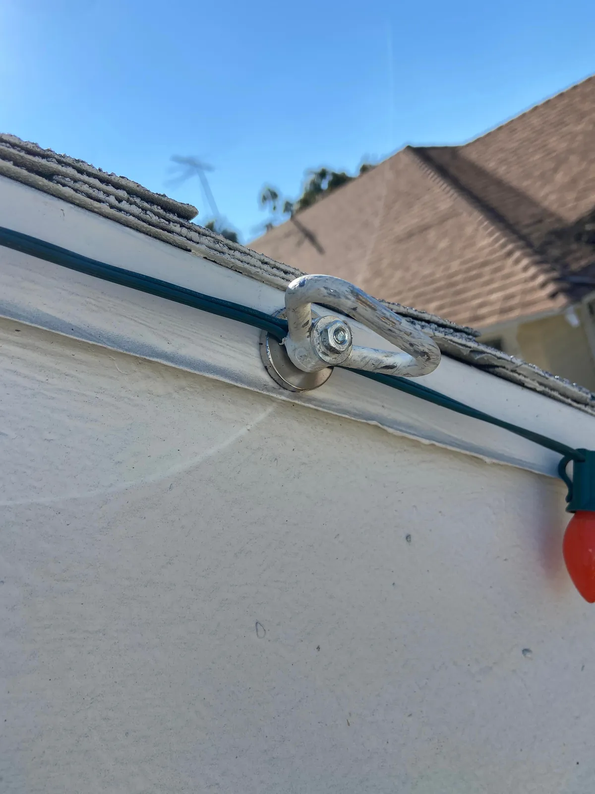 How I hang my Christmas lights with magnets and a long pole