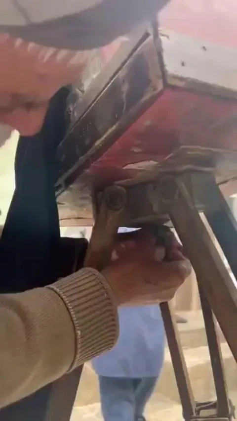 An elderly Afghan man started a small photography business with a century-old camera