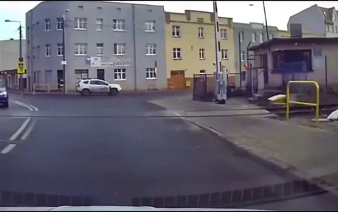 Guy closes cars bonnet and goes on about his day