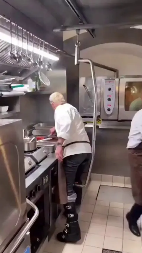 After a motorcycle crash left him with an 80% leg disability, Austrian chef Peter Lammer created a ceiling rail system that lets him move around the kitchen and continue working.