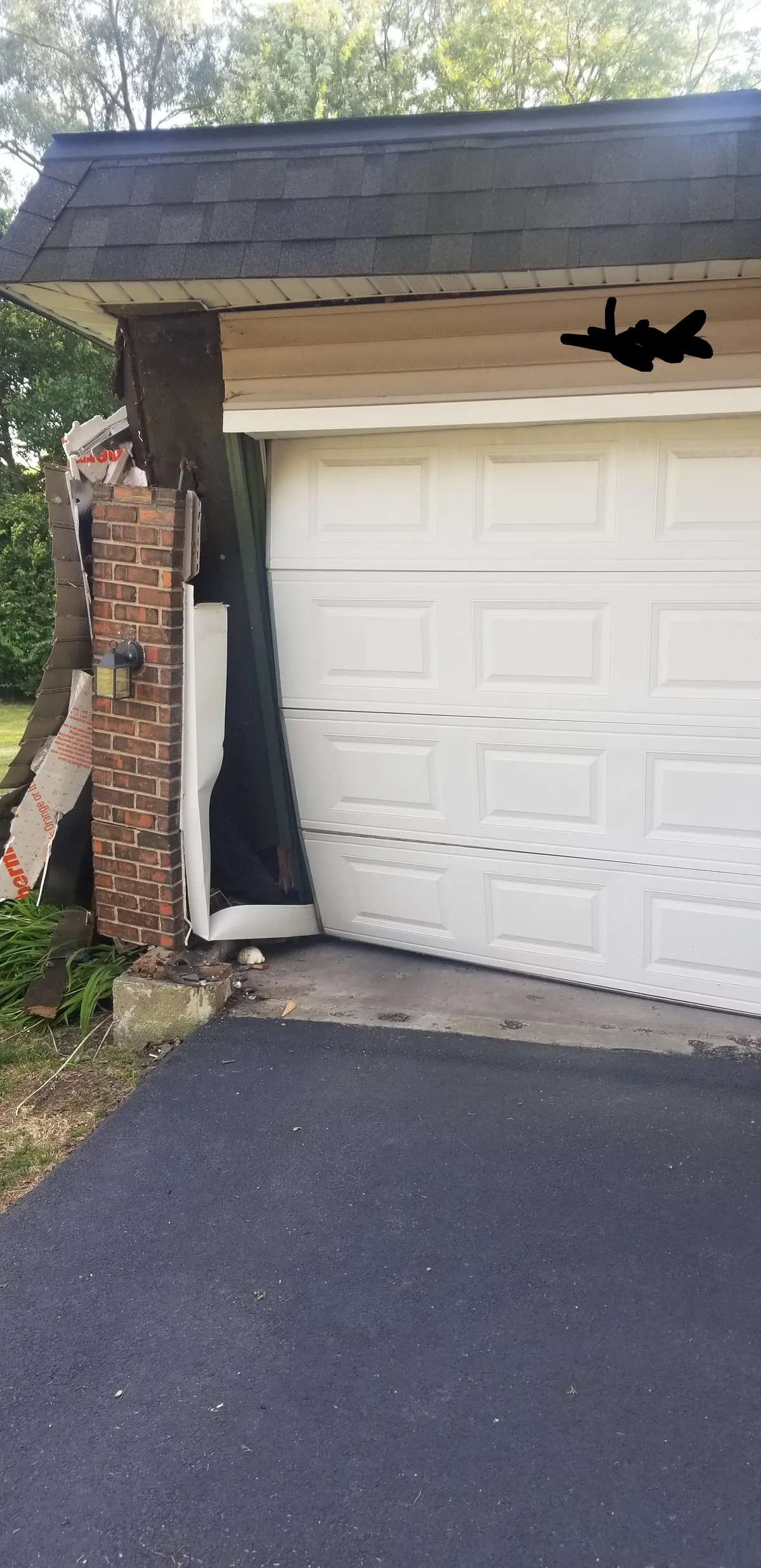 One year ago, someone crashed into my garage. They were able to drive away and have never been found.