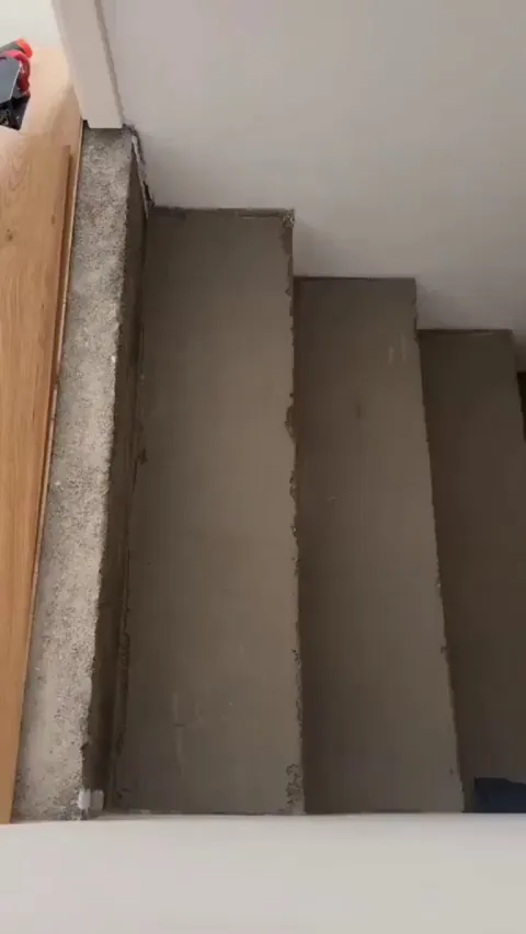 Laying wooden flooring on staircase
