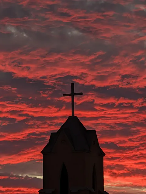 Sunset behind a church