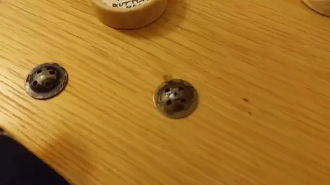 These are the buttons from a WW2 RAF uniform. When you put them together, they make a mini-compass, for use if you get shot down behind enemy lines.