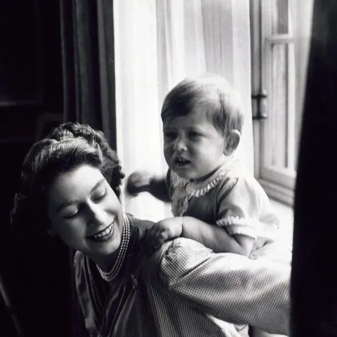 Queen Elizabeth II with her son Charles when he was still a baby, 1948