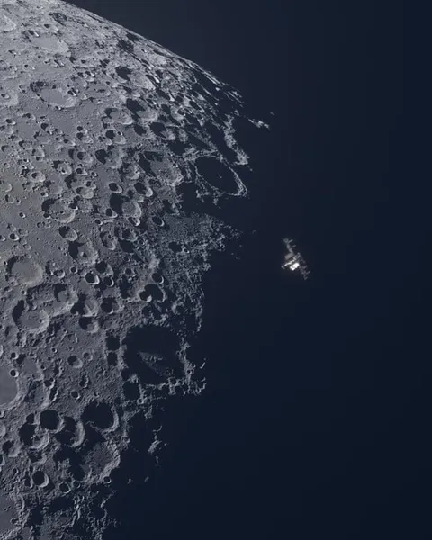 I used a 14" telescope to capture the moon, and was photobombed by the ISS