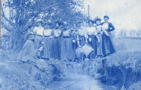 An unnamed young woman recorded her senior year at Asheville Female College in a photo album, Asheville, North Carolina, 1902. It includes a dorm room, group shots of friends, playing in snow, a visit to the mountains, their final midnight party before graduation, and graduation day itself.