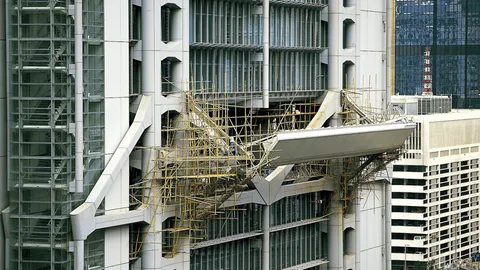 Traditional bamboo scaffolding used to construct the "high-tech" HSBC Building in Hong Kong, c. 1980s. (Foster + Partners)