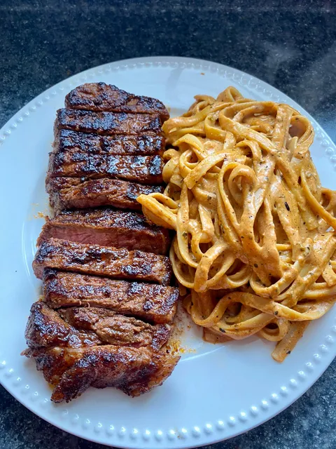 [Homemade] strip steak and Cajun pasta 