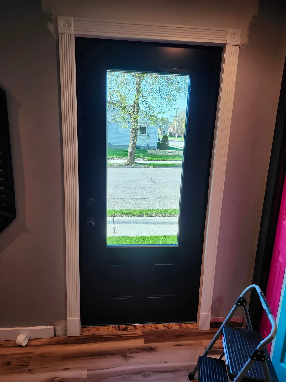 Contactors left this gap of plywood on the inside of the door. What are some ideas to cover it?