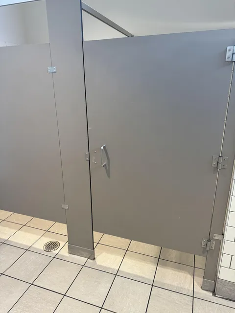 Guy in stall is just talking on the phone and I have to shit so bad.
