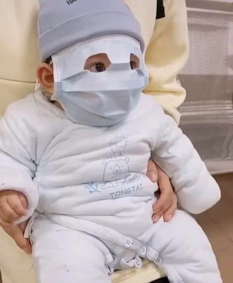 PsBattle: This baby wearing a face mask.