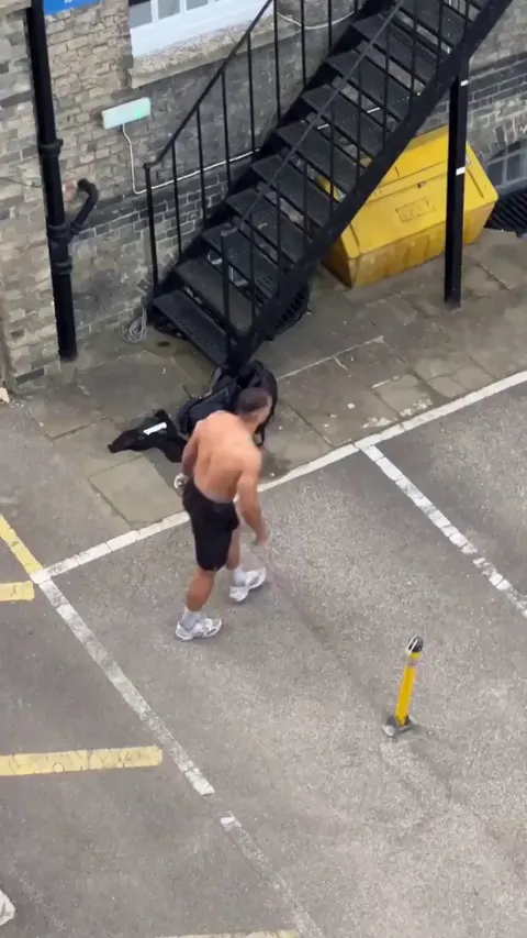 A guy climbs a building effortlessly