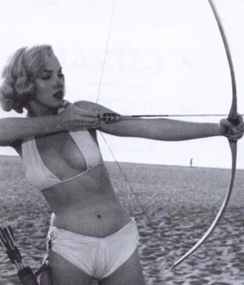 Marilyn Monroe practicing archery, 1951
