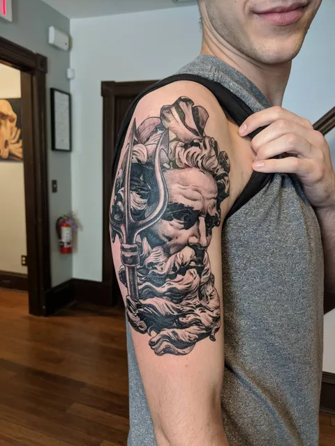 My first tattoo, Neptune with his trident. Done by Walter Lopez @ RedLetter1 in Tampa
