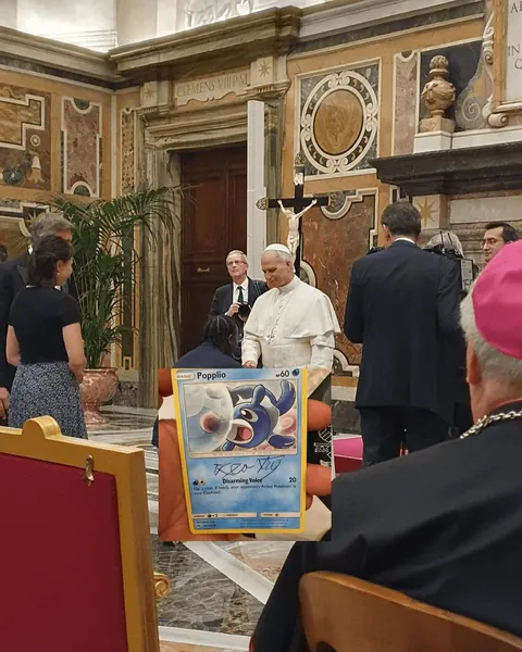 A man got his “Popplio” pokémon card autographed by Pope Leo