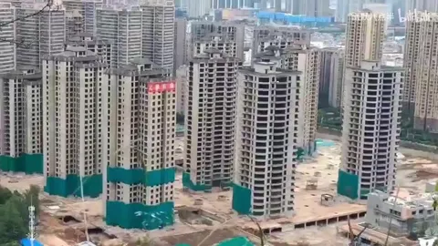 Blowing up 15 empty condos at once due to abandoned housing development