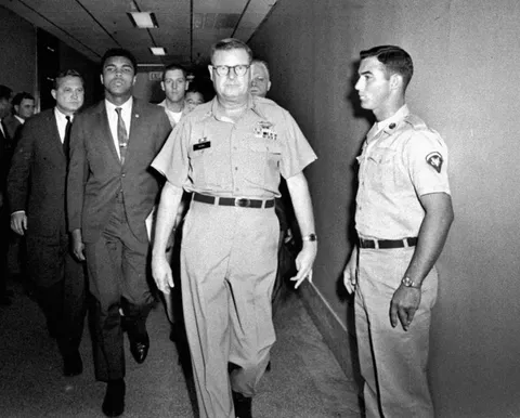 Muhammed Ali walks from the courtroom after being sentenced to five years as a concientious objector to the war in Vietnam (1967)
